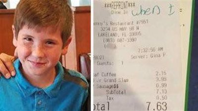 9-year-old boy gives unknown police officer a note in a restaurant