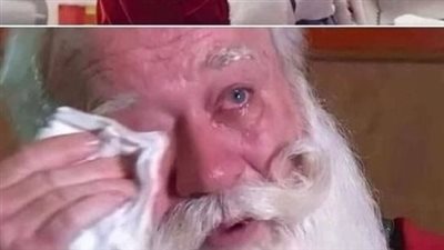 In the arms of Santa Claus, a cancer-stricken child passes away.